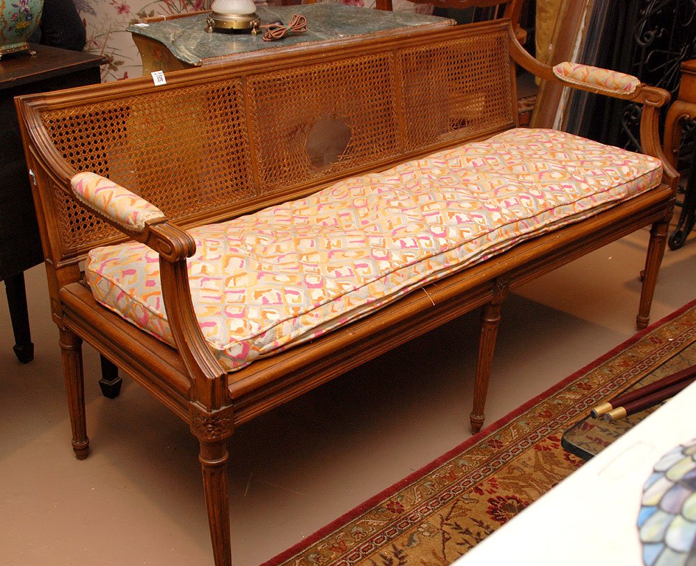Mahogany caned back settee, custom cushion on top of: Mahogany caned back settee, custom cushion on top of plywood bottom, 57 1/2"w (as is)