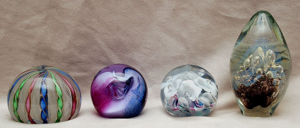 Four multi-colored art glass paperweights, signed: Four multi-colored art glass paperweights, signed Caithness and egg shape Eickholt 2002, tallest is 5 1/2"H, shortest is 2 1/2"H