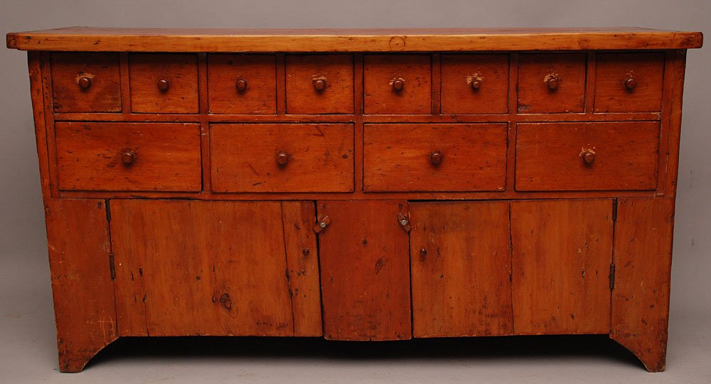 American 19th c. pine multi drawer, over 2 doors, hardw: American 19th c. pine multi drawer, over 2 doors, hardware store/apothecary style cabinet, 36"h x 67"w x 21"d
