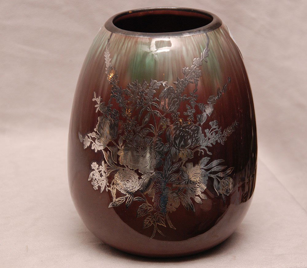 American pottery vase with mottled glaze and silver flo: American pottery vase with mottled glaze and silver floral overlay design, 7 1/2"h