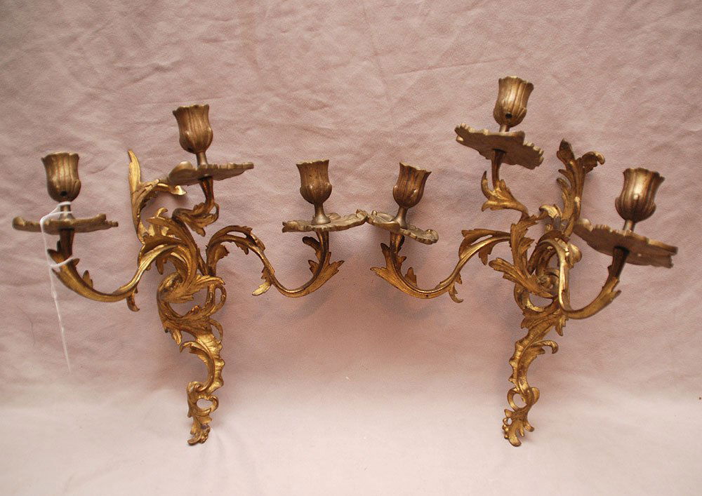 Pair of French Louis XVI Style Bronze Three Arm Gilded: Pair of French Louis XVI Style Bronze Three Arm Gilded Wall Sconces Bearing a Scrolling Foliate Decoration. Never been electrified. 15" by 12". (150-300).