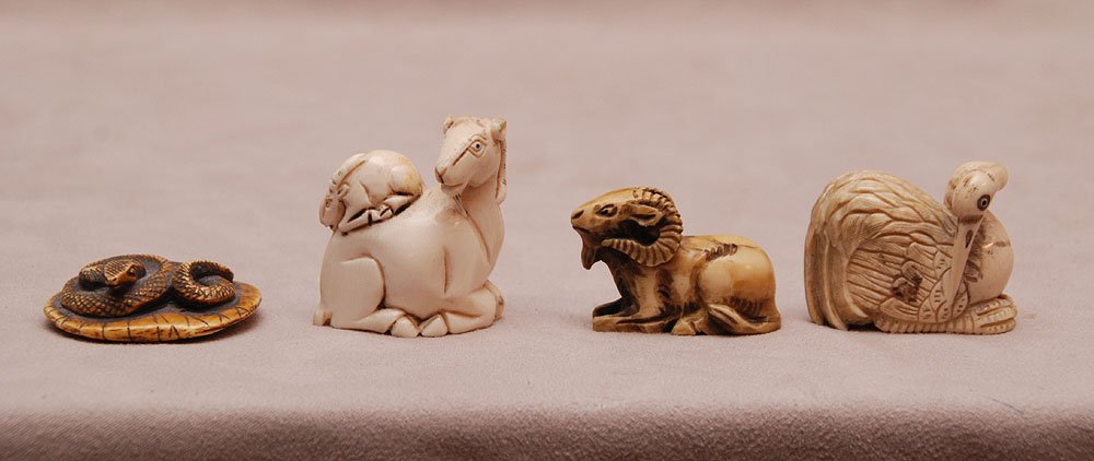 4 carved ivory netsukes: 4 carved ivory netsukes