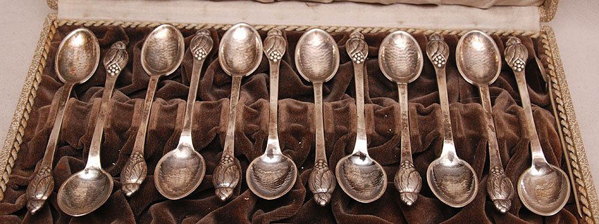 Evald Nielsen, Denmark 1879-1958. Set of 12 Chased: Evald Nielsen, Denmark 1879-1958. Set of 12 Chased Finish Coffee Spoons, along w/a stirrer, in the original presentation box. Each spoon is marked with the initials E. N, No 6, 1929, S , 830. The inne