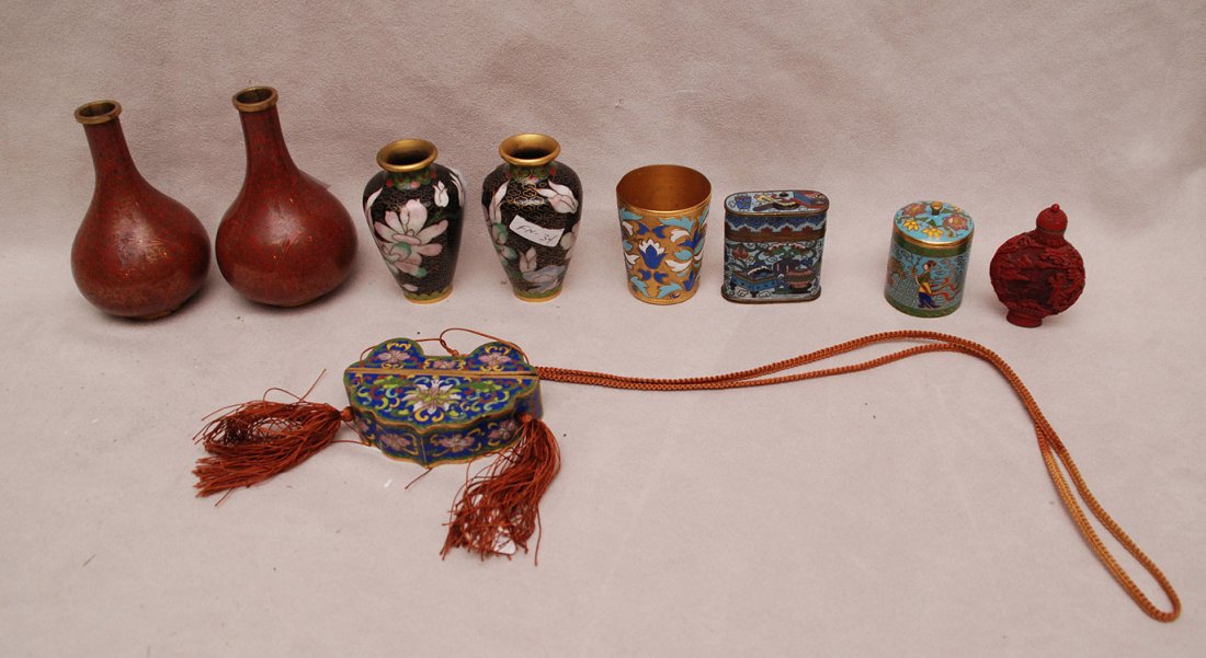 9 CloisonnÃ© pieces, incl; pair of vases (4"h),: 9 cloisonné pieces, incl; pair of vases (4"h), cinnabar snuff bottle (2"h), match holder (2" x 2"), pair of fine cloisonné vases (3"h), unusual 2pc. Box on sash, (2 1/2"h x 3 1/2"w), jigger (2"h) an