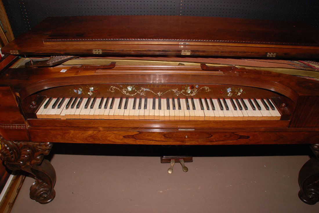 Antique piano, J&C Fischer NY, Rosewood case with: Antique piano, J&C Fischer NY, Rosewood case with mother of pearl design, heavily carved legs, some ivory keys not working, 38"h x 76 1/2"w x 39"d