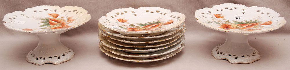 7 reticulated plates (8 1/2"dia) and 2 matching: 7 reticulated plates (8 1/2"dia) and 2 matching compotes, orange floral design, (4"h x 8"dia)