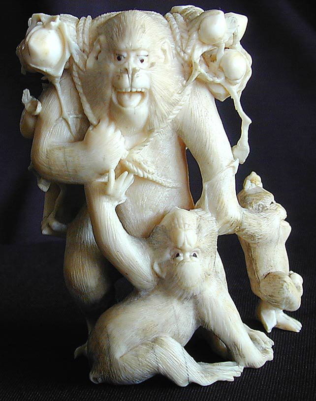 Late19thc Japanese Ivory Monkey Persimmons Okimono A: Late19thc Japanese Ivory Monkey Persimmons Okimono A Meiji Period openwork carved ivory okimono of a male father monkey with 3 small offspring; the father monkey carrying a wrapped harvest of persimmo