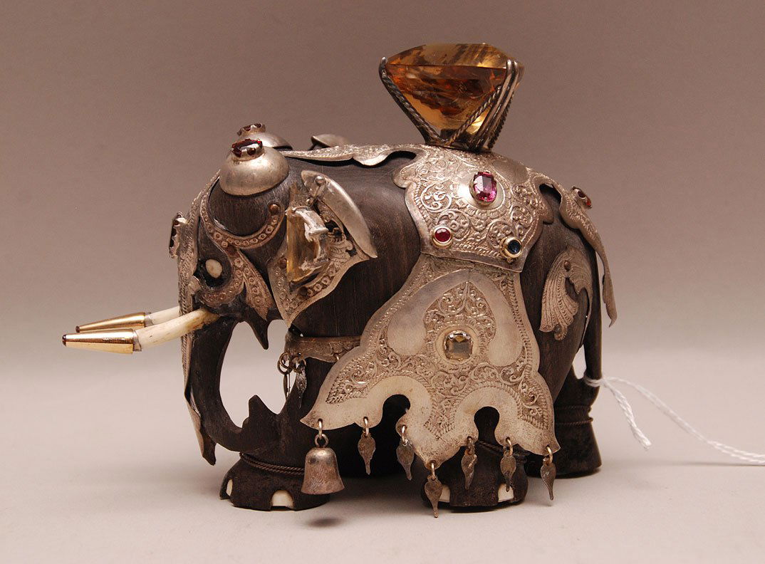 Carved Ebony Elephant with silver and jeweled garment. : Carved Ebony Elephant with silver and jeweled garment. Condition: good. Ht. 4 3/4"