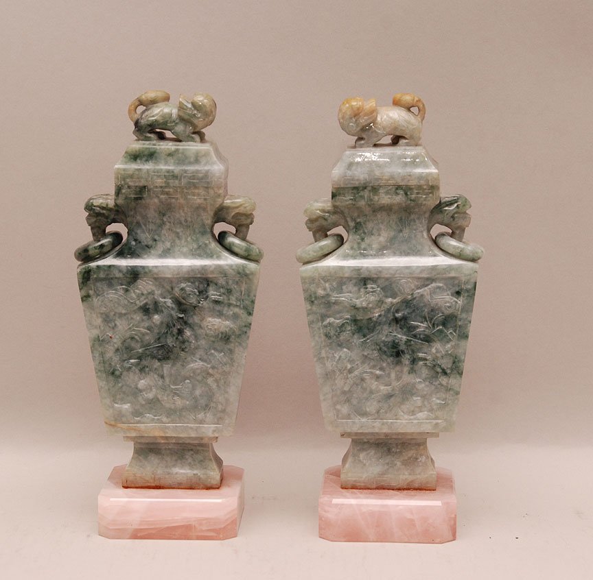 Pair of Carved Jade Urns and Covers with rose quartz ba: Pair of Carved Jade Urns and Covers with rose quartz bases. Condition: good. Ht. 8 1/2"