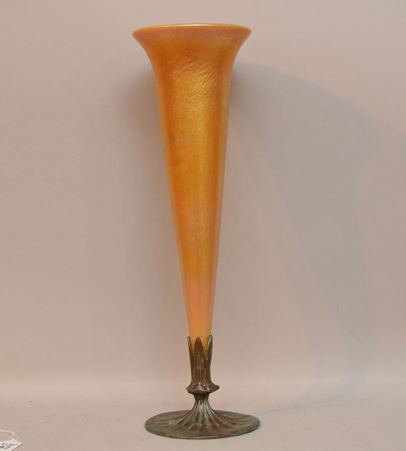Tiffany Favrile Glass Vase with Tiffany Studios Bronze : Tiffany Favrile Glass Vase with Tiffany Studios Bronze Base. The bronze base is signed Tiffany Studios New York 1153. Condition: very good. The glass vase has been affixed to the bronze base. Ht. 18"
