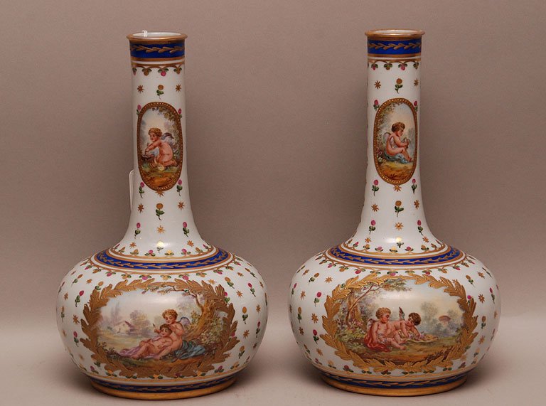Pair Antique "Sevres" Porcelain Hand Painted Vases each: Pair Antique "Sevres" Porcelain Hand Painted Vases each with handpainted putti scene front and handpainted landscape scene back. Condition: very good. Ht. 10"