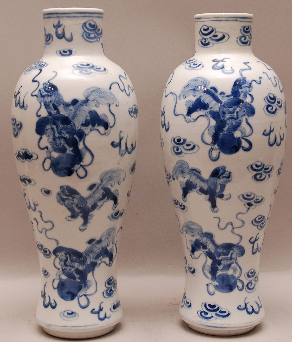 Pair Chinese 19th Century Blue & White Vases with conti: Pair Chinese 19th Century Blue & White Vases with continuous foo dog and scroll decoration. Condition: good for their age with minor normal wear. Ht. 12"
