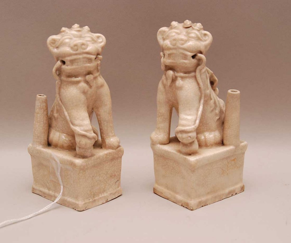 Pair Early Chinese Porcelain Foo Dogs. Condition: show: Pair Early Chinese Porcelain Foo Dogs. Condition: showing normal wear for their age. Ht. 5 1/2"