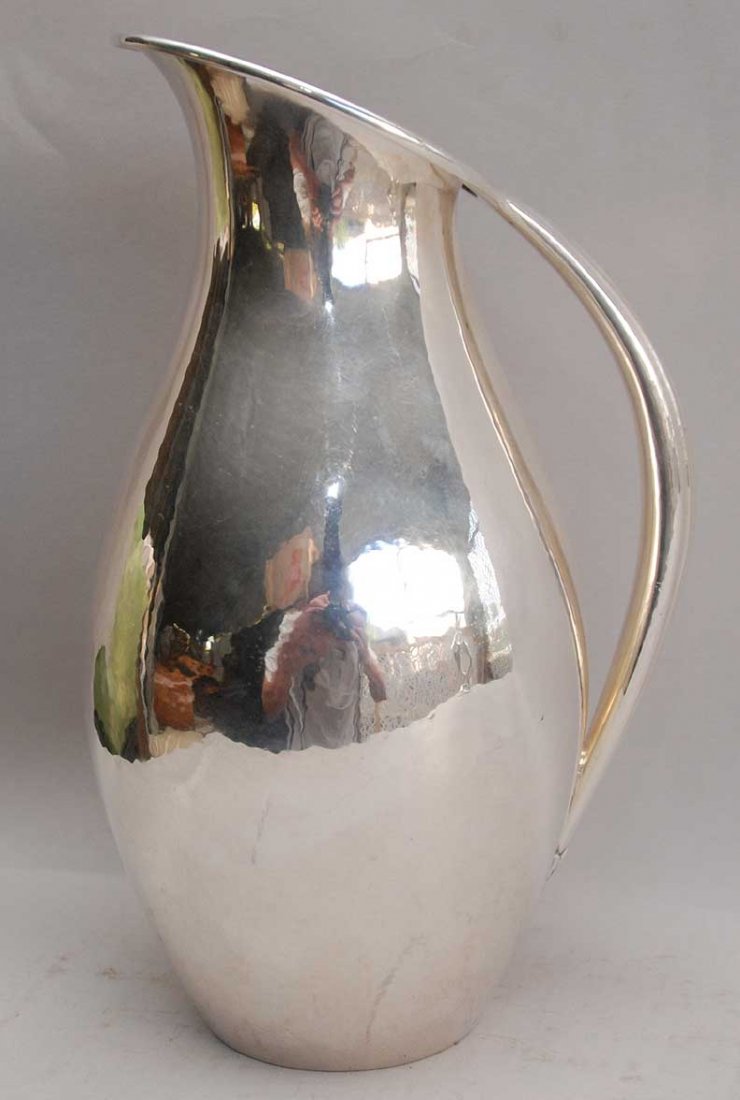 Georg Jensen sterling pitcher, 18 ozt, 9"h: Georg Jensen sterling pitcher, 18 ozt, 9"hhas a 1" long dent, see last picture attached