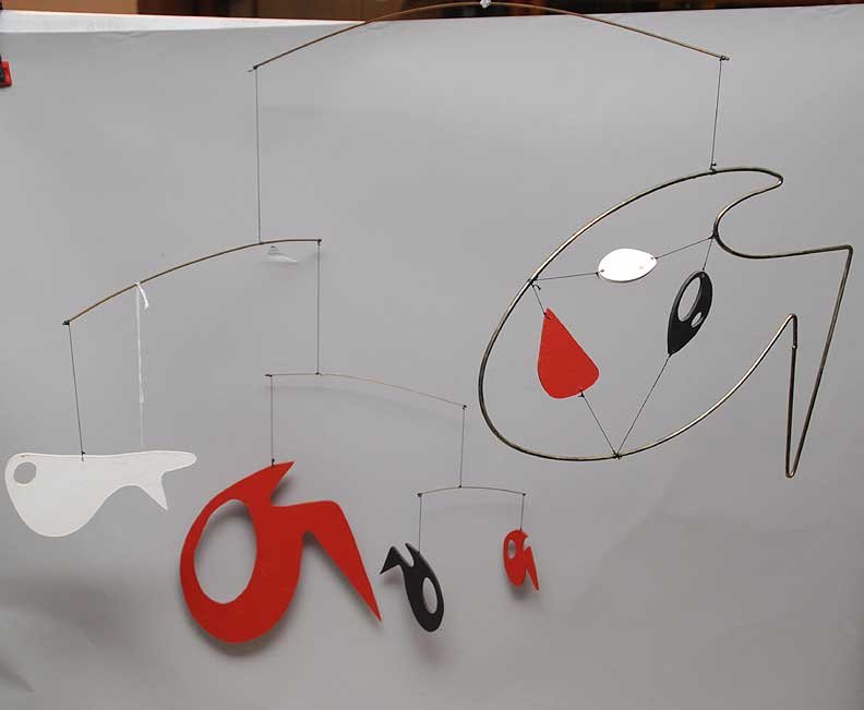 After ALEXANDER CALDER (Mobile Sculpture), untitled, tw: After ALEXANDER CALDER (Mobile Sculpture), untitled, two feet high and three feet wide with seven sections of wire and plastic. Bears a signature on one of sections “CA”.
