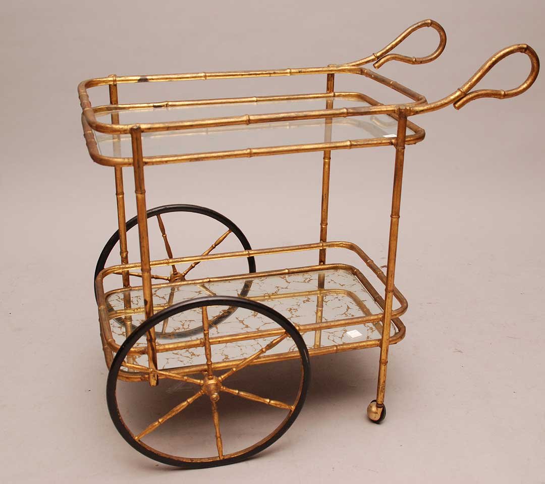 Gilt metal tea wagon, bamboo motif, glass & mirrored gl: Gilt metal tea wagon, bamboo motif, glass & mirrored glass surfaces (gilding worn, some rust)