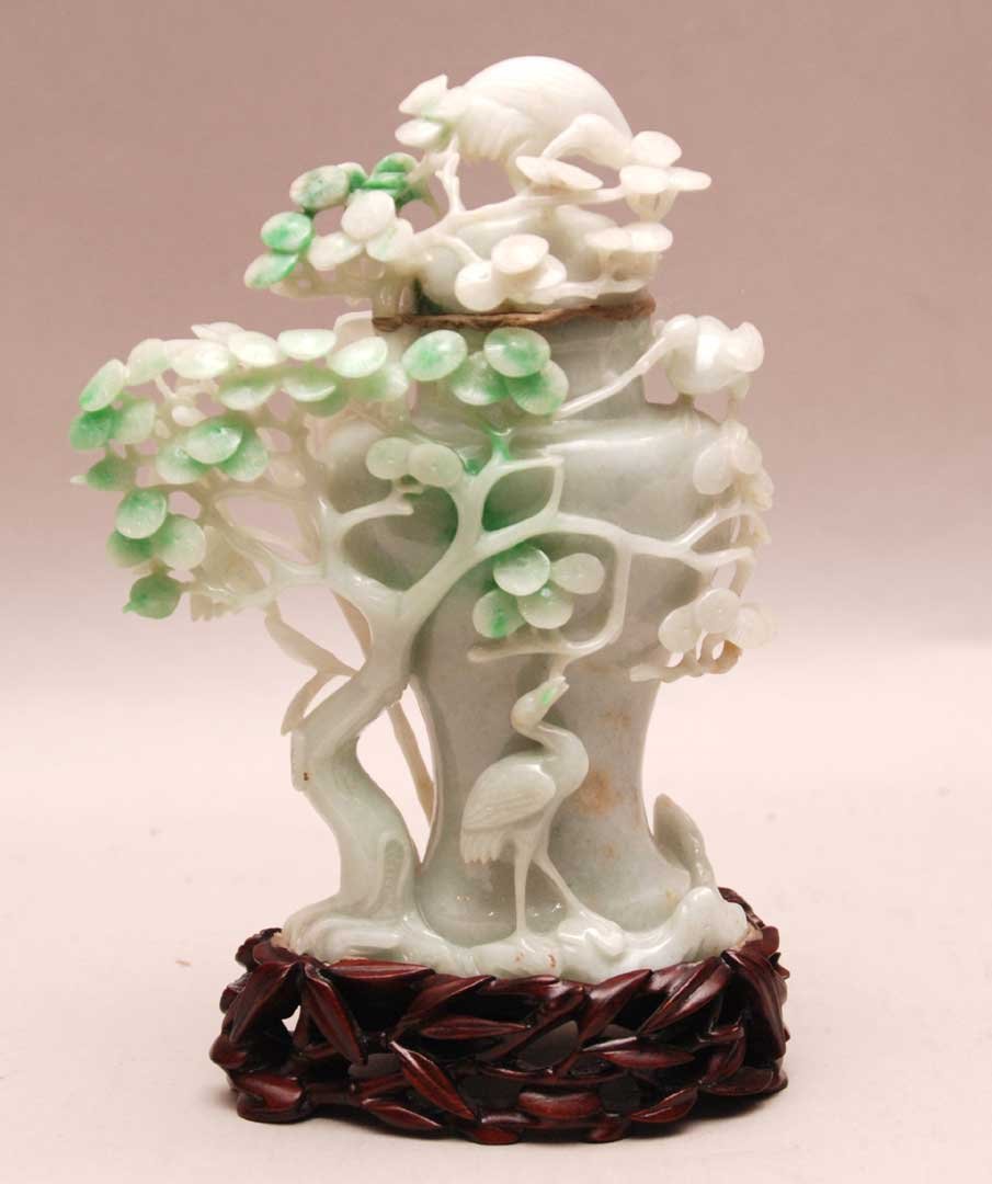 Antique Chinese White Jade Urn & Cover. The finely: Antique Chinese White Jade Urn & Cover. The finely carved urn has the white jade color moving to green in the foliage. Condition: good with minor normal wear. Ht. 5 1/2" W. 4 1/2" D. 2 1/4"