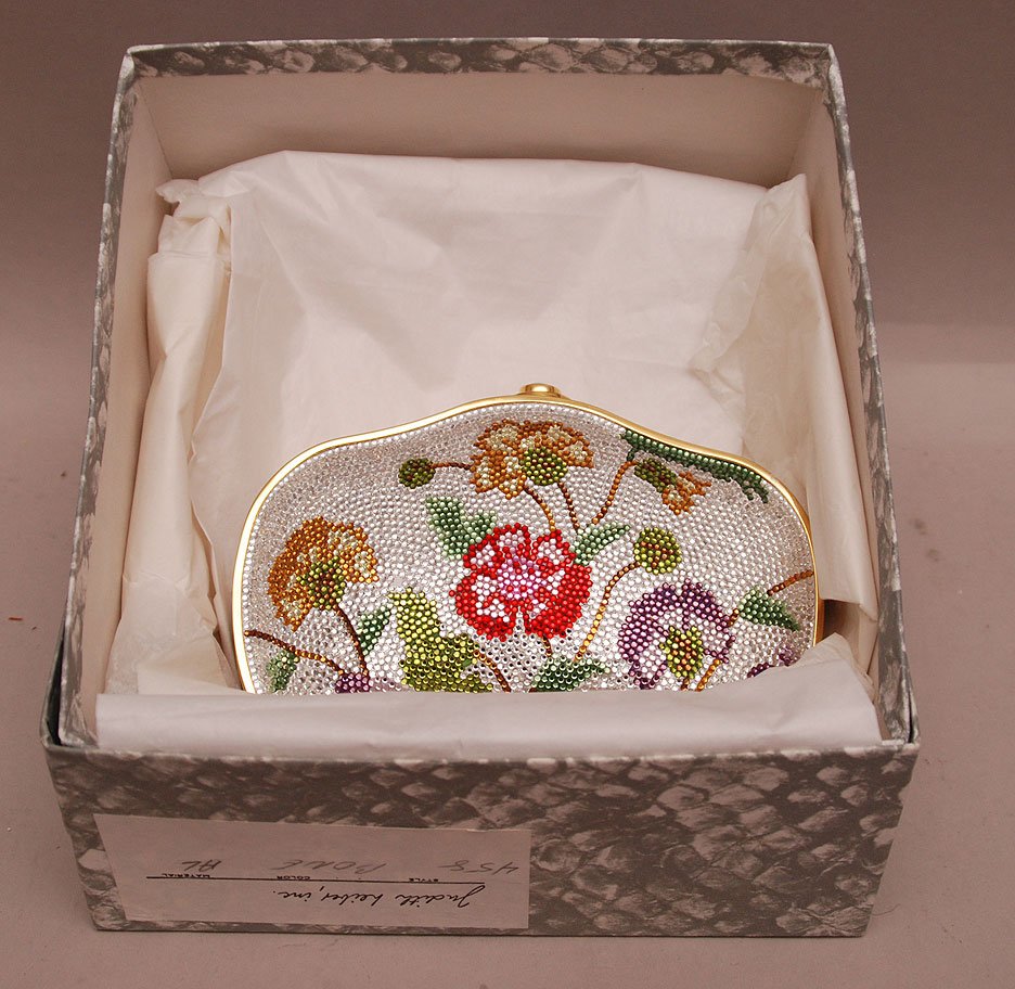 Judith Lieber evening bag with floral pattern design in: Judith Lieber evening bag with floral pattern design in cloth sleeve and original box (crystals missing from front and back)