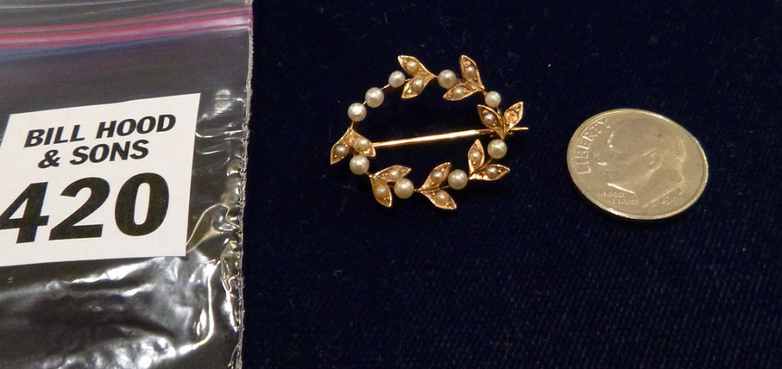 One ladies 14kt yellow gold seed pearl stick pin: One ladies 14kt yellow gold seed pearl stick pin containing 22 seed pearls from 1.0-2.50, set in a "grapevine" style pin weighing 2.88 grams