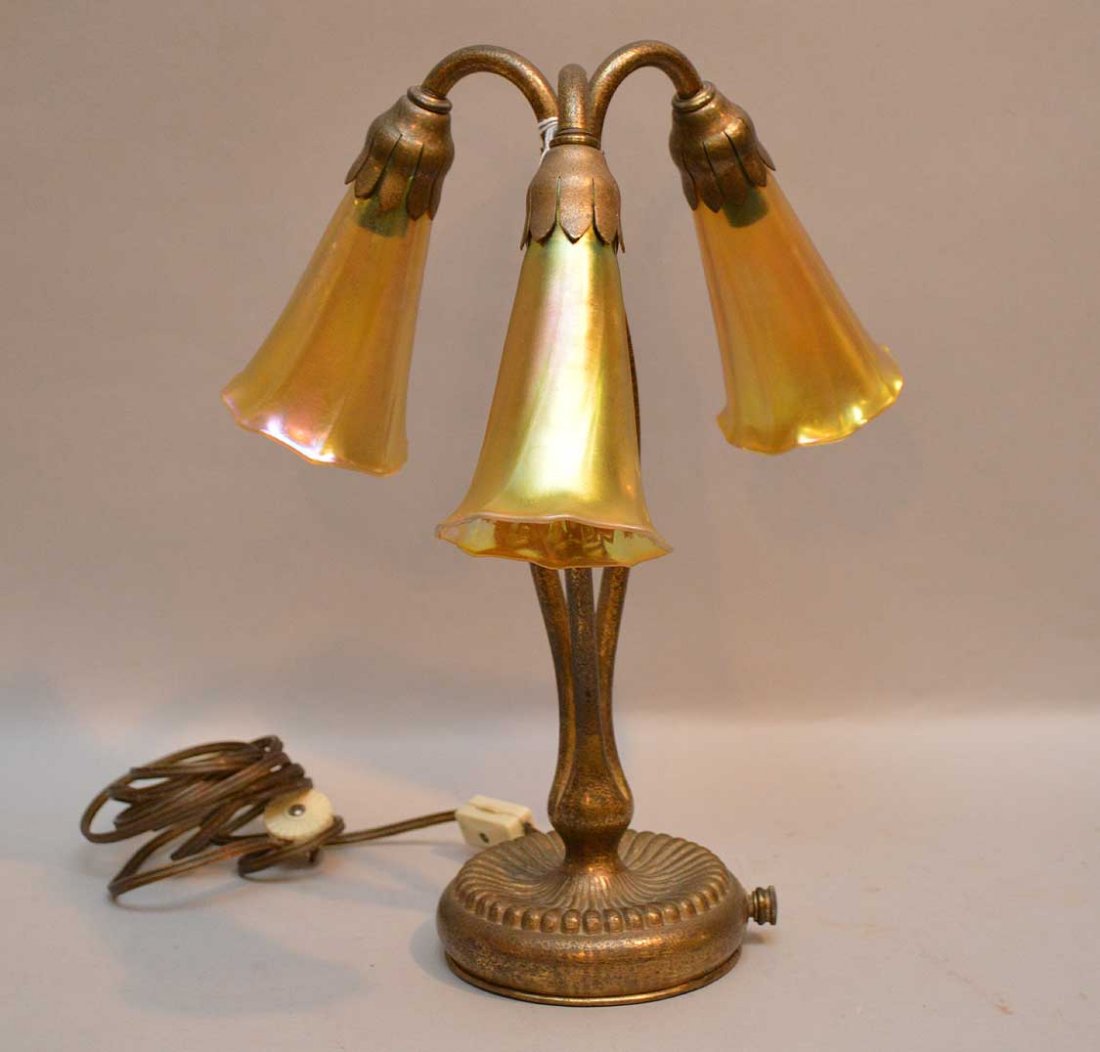 Tiffany Studios Bronze Desk Lamp. Signed Tiffany: Tiffany Studios Bronze Desk Lamp. Signed Tiffany Studios New York 319 on the base. Condition: good with three Lundberg Studios shades. Ht. 12 3/4"