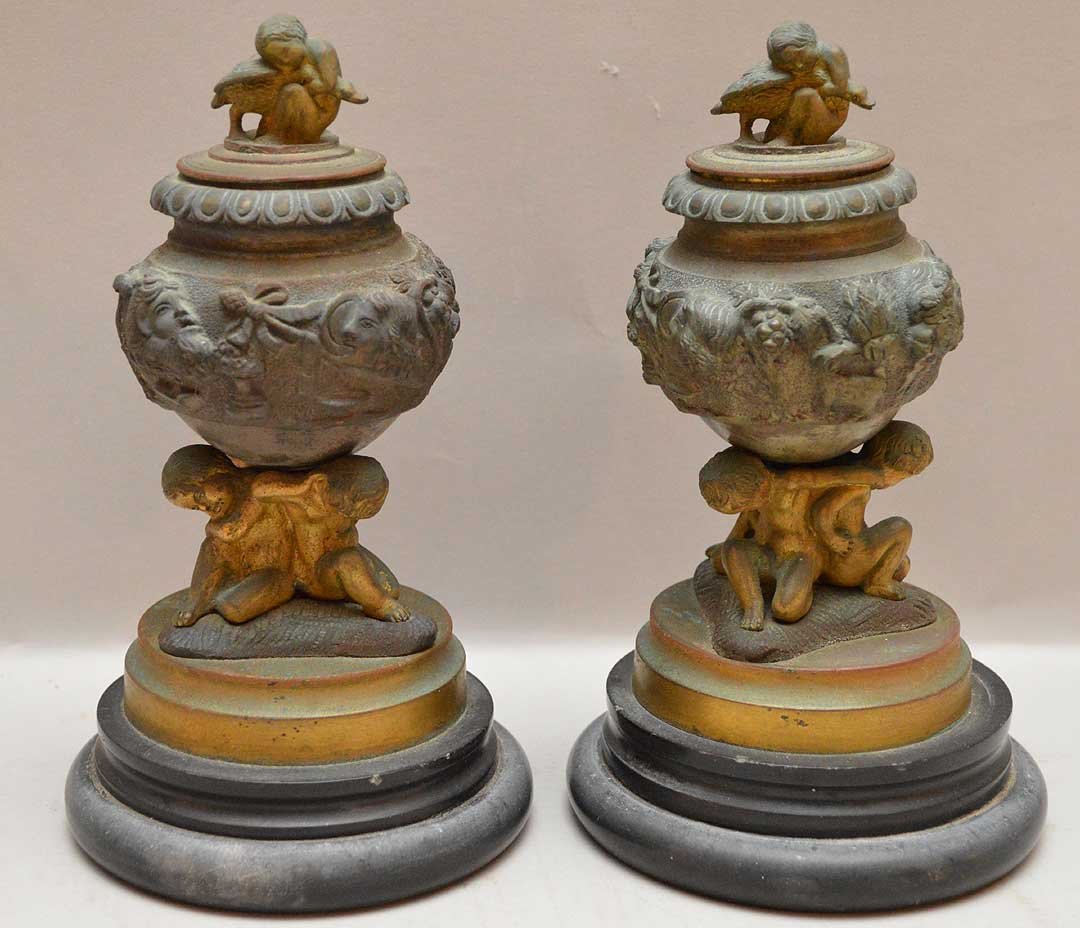 Pair of small bronze covered urns each with 3 putti (1 of 5)
