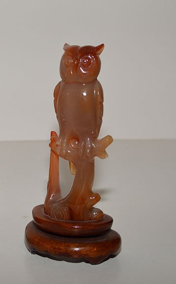 Chinese Carnelian Owl mounted on a custom wood base.: Chinese Carnelian Owl mounted on a custom wood base. Condition: good. Ht. 5 1/2" including the stand.