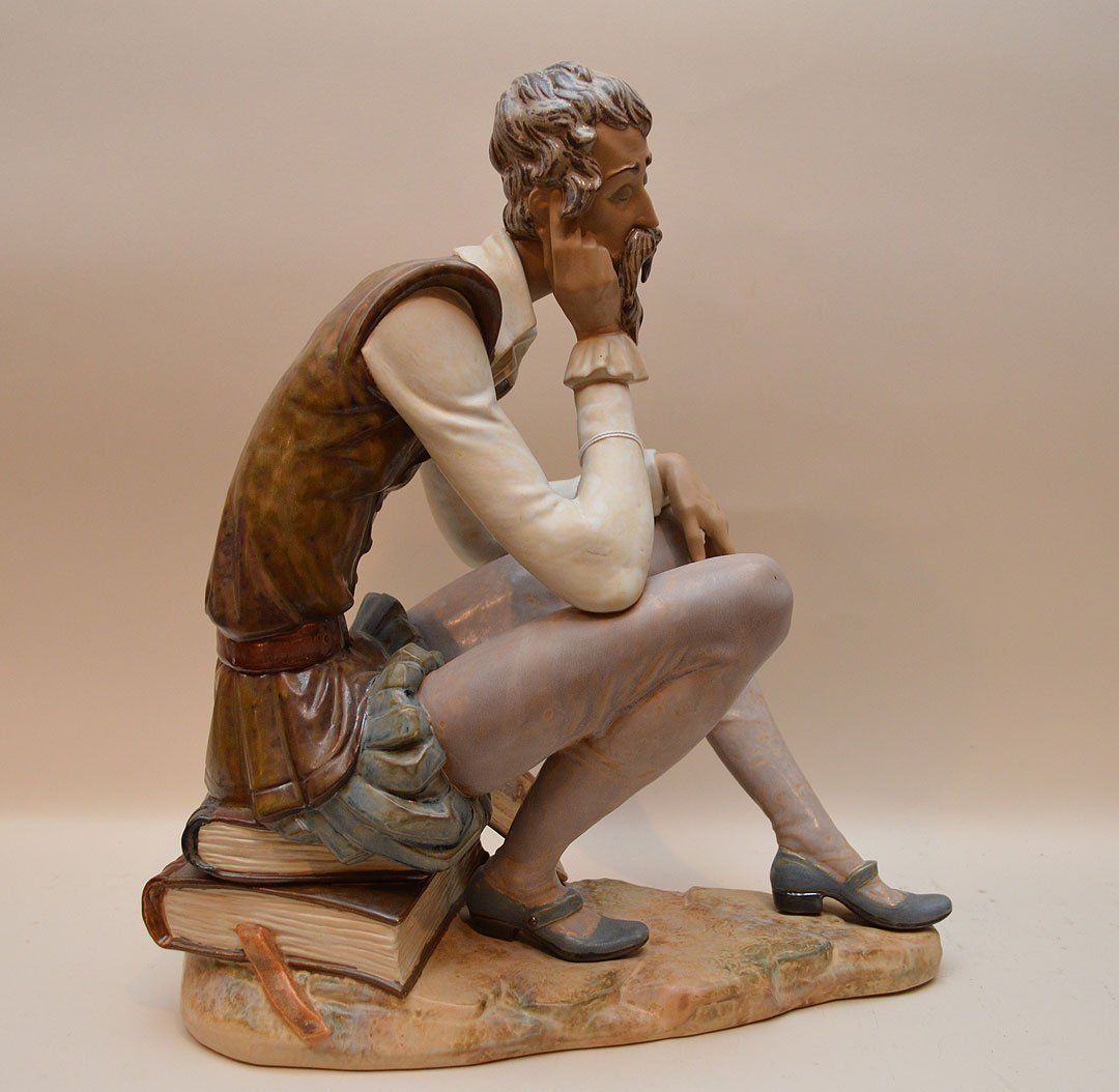 Large Lladro fellow sitting on 2 books catching a (1 of 4)