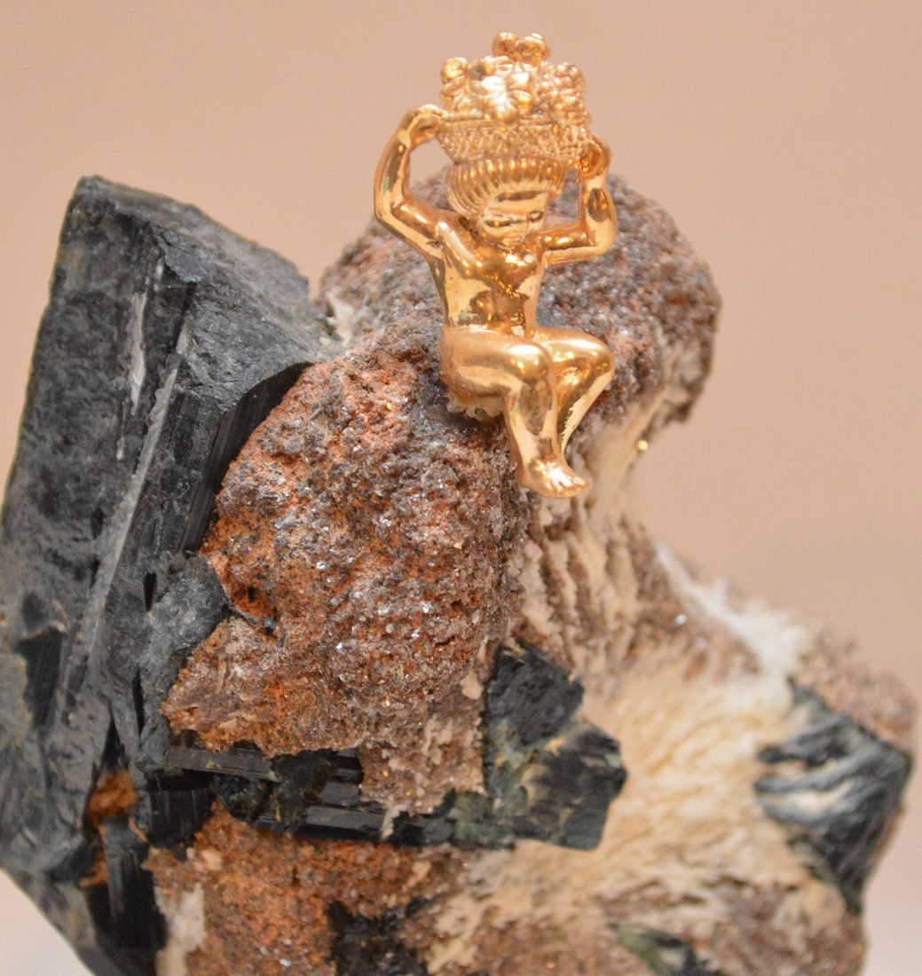 14K Yellow Gold figure on an unpolished rock base. Ht.: 14K Yellow Gold figure on an unpolished rock base. Ht. 6" including wood stand.