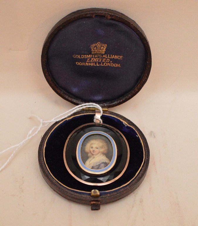 Antique mourning locket, gold frame, faceted amethyst: Antique mourning locket, gold frame, faceted amethyst glass surrounding enameled oval frame with portrait of young female, back opens for hair