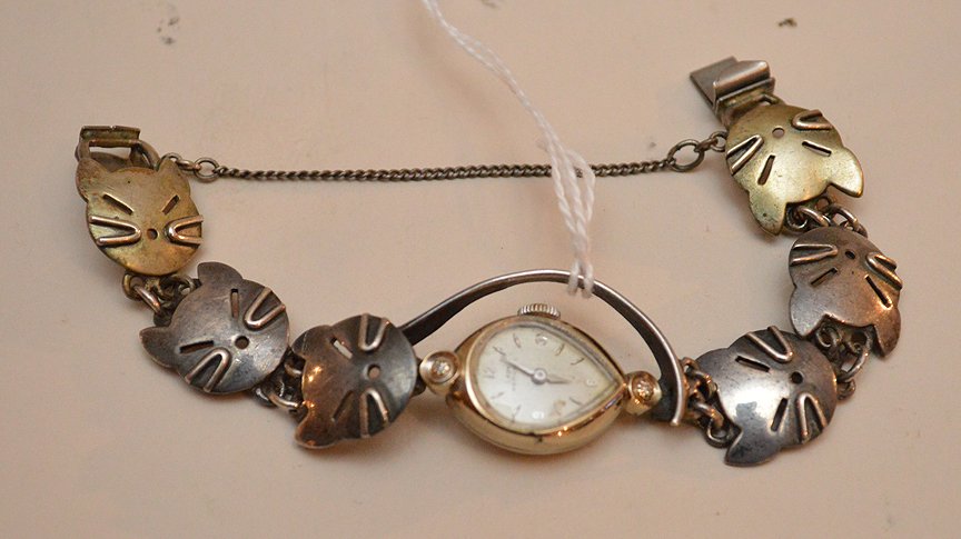 Hamilton Ladies Watch with 14K gold case and sterling: Hamilton Ladies Watch with 14K gold case and sterling cat band. Lth 4 1/2"
