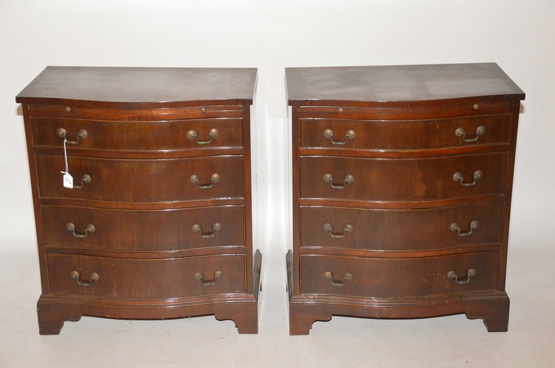Pair 20th c. mahogany serpentine chests (1 of 2)