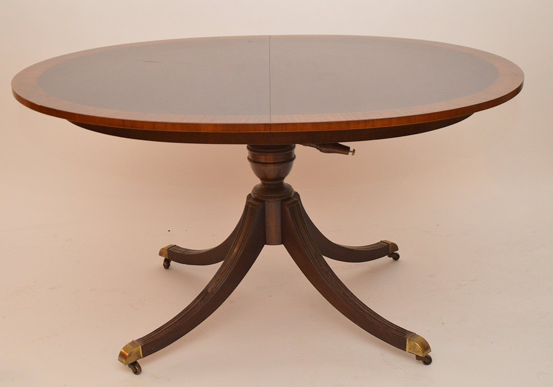 Mahogany oval table with banded rim on center pedestal (1 of 6)