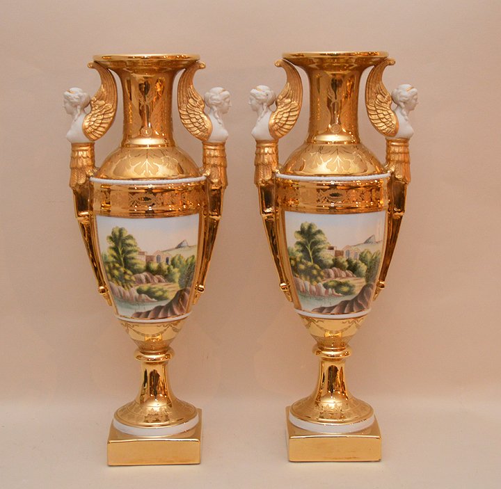 2 Chelsea House large porcelain English Empire style: 2 Chelsea House large porcelain English Empire style urns with heavy gold gilt and handpainted landscape scenes with female handles, 18"h x 7 1/2"w
