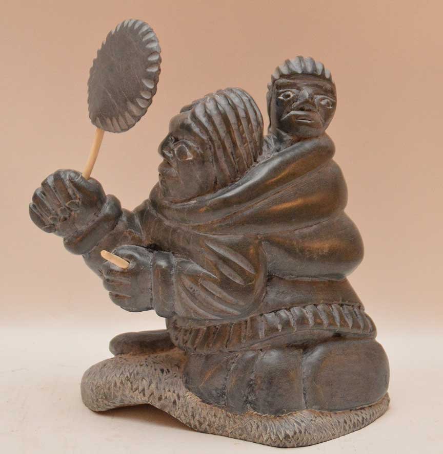 Carved Inuit mother with child, 8 1/2"h x 8"w: Carved Inuit mother with child, 8 1/2"h x 8"w