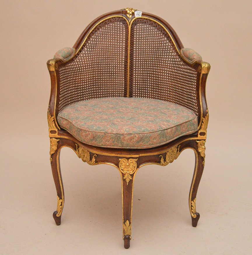 Caned back arm chair gilded carved accents: Caned back arm chair gilded carved accents