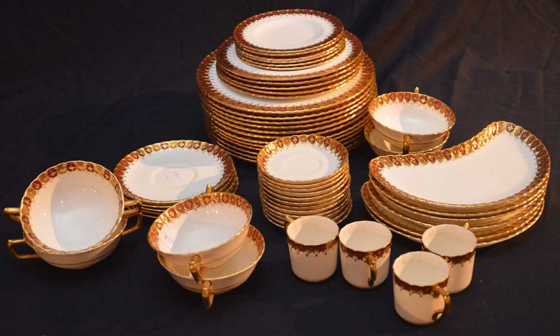 Royal Crown Derby china with raised red and gold rims,: Royal Crown Derby china with raised red and gold rims, incl; 12 plates (10 1/2"dia), 5 plates (8 1/2"dia), 4 cups, 12 saucers (4 1/2"dia), 6 plates (6 1/2"dia), 5 saucers (6 1/2"dia), 6 bone dishes an