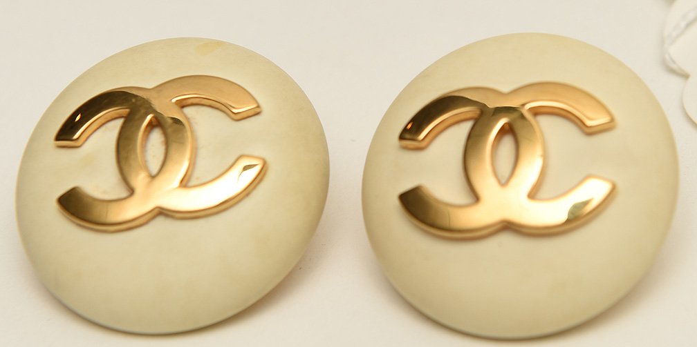 Pair Chanel vintage gold plated and leather clip on: Pair Chanel vintage gold plated and leather clip on earrings, marked Chanel Made in France