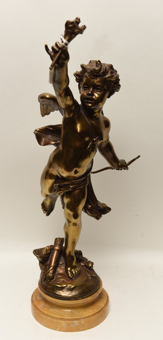 LEON GREGOIRE, French 19th Century, “Cupid with Bow and: LEON GREGOIRE, French 19th Century, “Cupid with Bow and Torch”, metal sculpture 24” high including marble base, signed in the metal, the gilt patina shows some rubbing losses.