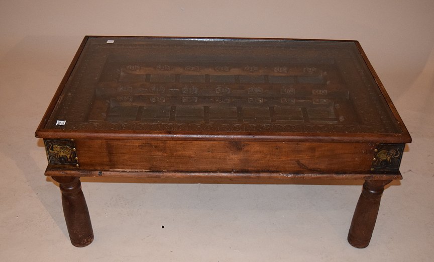 Indonesian coffee table with glass top, 19"h x 43"w x: Indonesian coffee table with glass top, 19"h x 43"w x 28"d