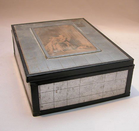 2 old boxes, one black with metal decorations, oth: 2 old boxes, one black with metal decorations, other metal with picture in middle