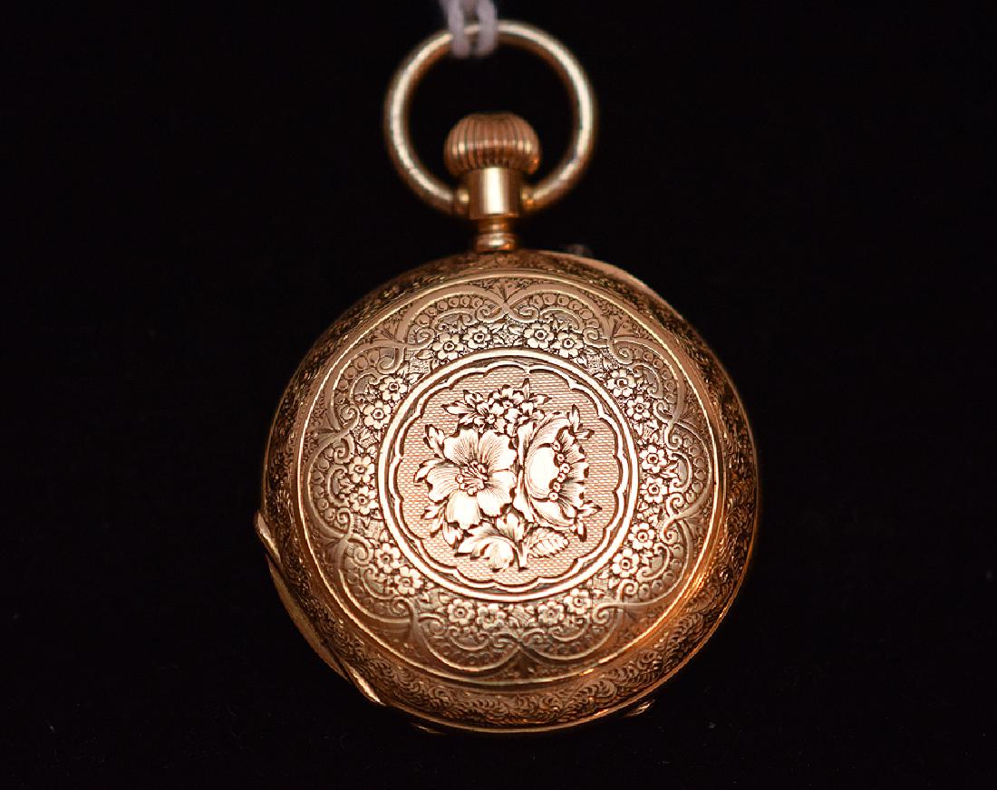 Ladies 18K Yellow Gold Pocket Watch. The interior case: Ladies 18K Yellow Gold Pocket Watch. The interior case marked 18K along with a impressed TS and the number 89383 with a number below 1096. Ht. 2”