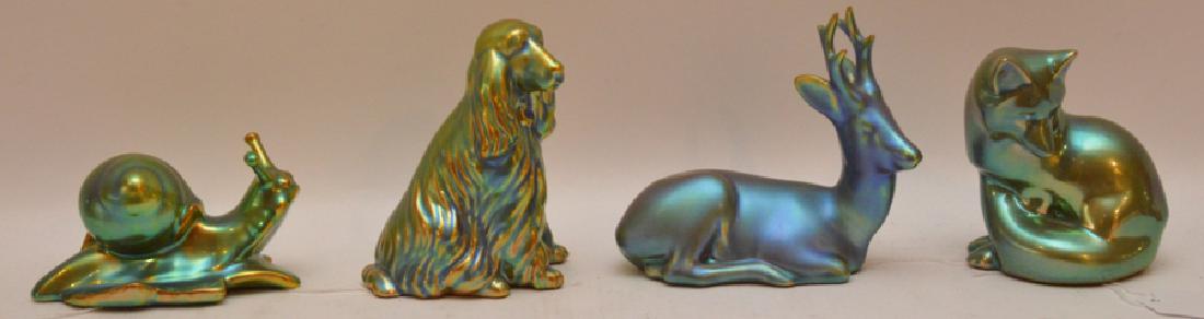 4 Zsolnay Porcelain Figures with iridescent glaze. Dog: 4 Zsolnay Porcelain Figures with iridescent glaze. Dog Ht. 4 1/4" Fox Ht. 4" Deer Ht. 4 3/4" Snail Lth. 4 1/4"