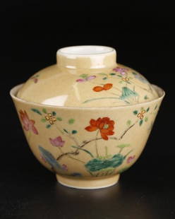 A Famille Rose Porcelain Lidded Bowl: Two pieces in total. Brown glazed and decorated with lotus flowers. Marked 'Dao Guang Nian Zhi' from late Qing Dynasty. Dia: 10cm. H: 8.8cm.