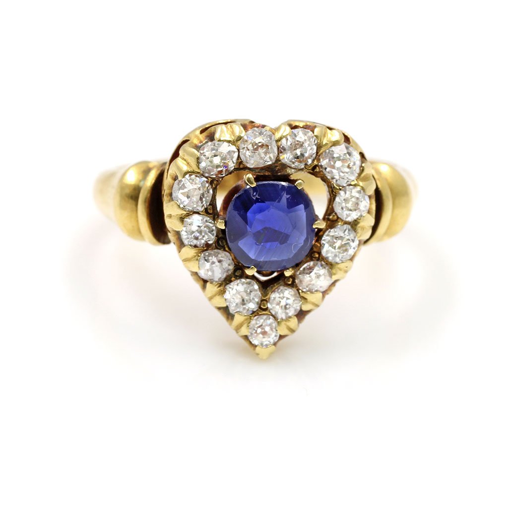 20k Gold, Sapphire & Diamond Ring: 20k Gold, Sapphire & Diamond heart shaped ring Sapphire approx.: Old miner diamond approx. .50 ct total Mounting: 20k Gold Ring size: 4.5 Total weight 3.78 g.