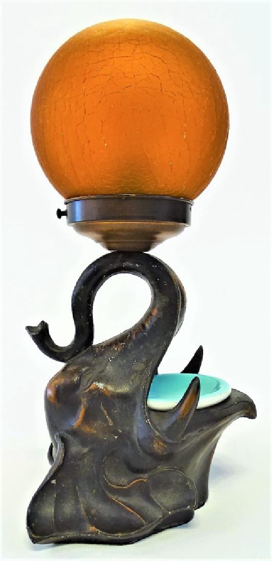 DECO FRANKART SIGNED ELEPHANT HEAD LAMP: Rewired with vintage czech orange globe, measures from base to top of globe 13" , old American china bowl, in great condition for the period we will not ship but can refer local shippers