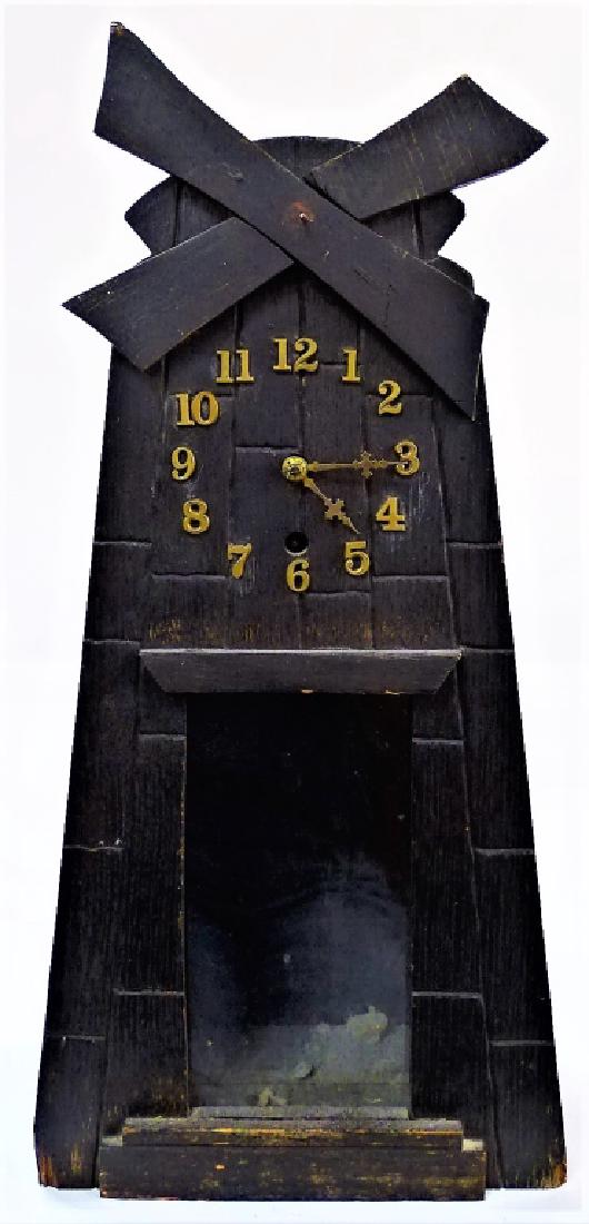 GILBERT CLOCK CO MISSION OAK WINDMILL SHELF CLOCK: Late19th - Early 20th century Mission Oak windmill shelf clock by Gilbert Clock Co., Winsted, CT. Having applied Brass Arabic numerals. Fit with time and strike movement. Has original paper label appl