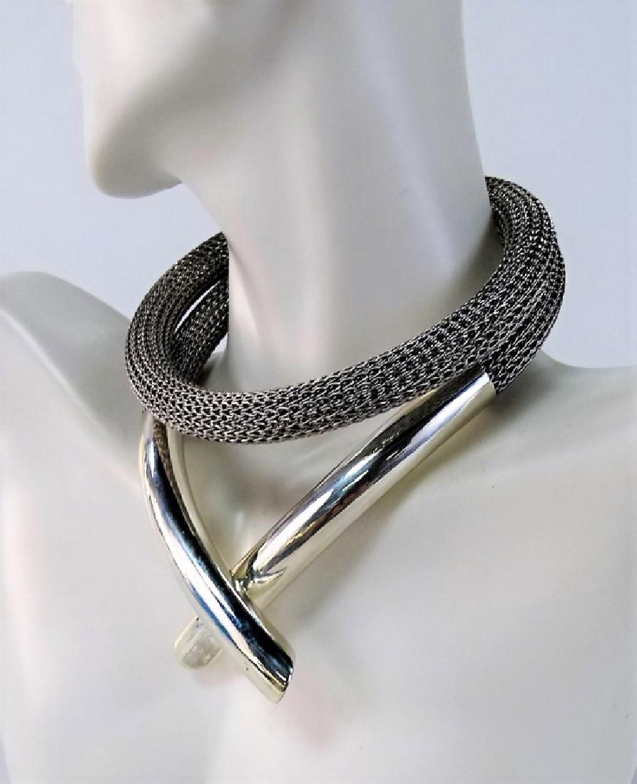 MODERN STERLING & STAINLESS STEEL CHOKER NECKLACE: Modern style Sterling Silver and Stainless Steel choker necklace. With unique tubular mesh design. Having Sterling Silver caps with magnetic closure. Measures approx. 24" in length. Shipping to be $20