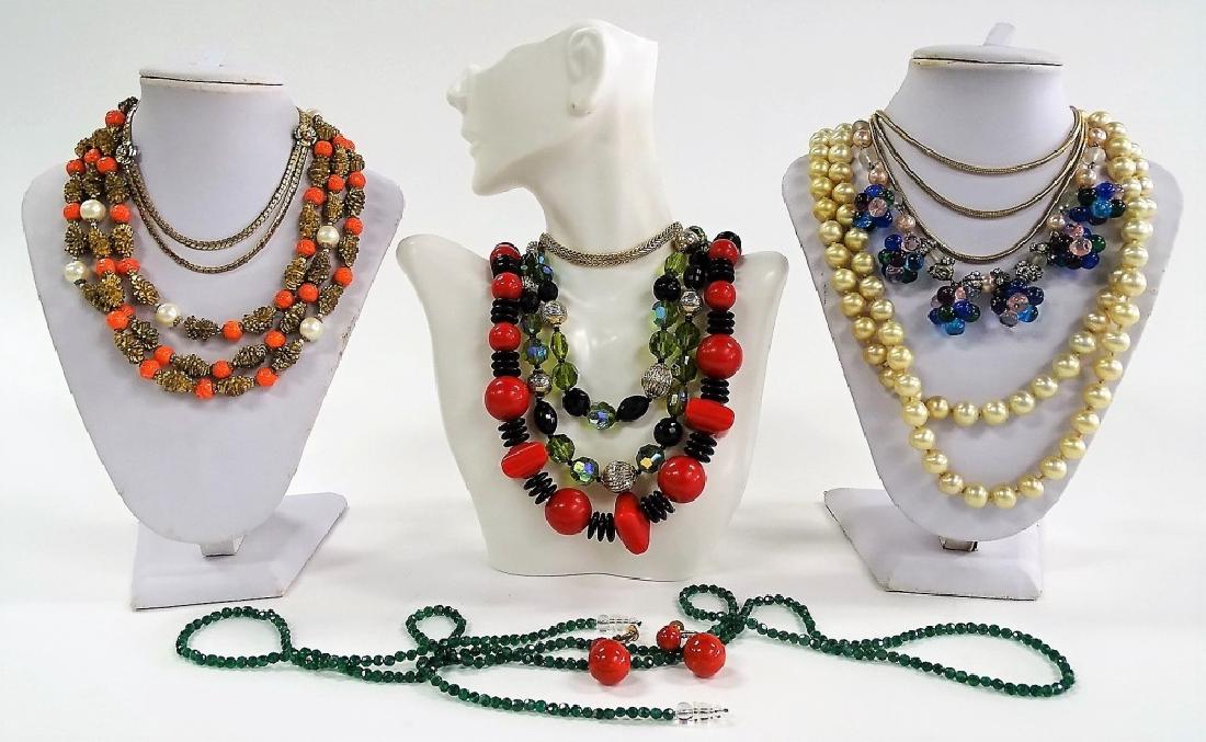LARGE LOT OF COSTUME NECKLACES: To include an unsigned gold tone w/ faux pearl and carnelian agate necklace, a Bigney 12K GF 3 strand necklace, a faux pearl w/ marcasite 2 strand necklace, a Probst 12K GF floral necklace, a signed D