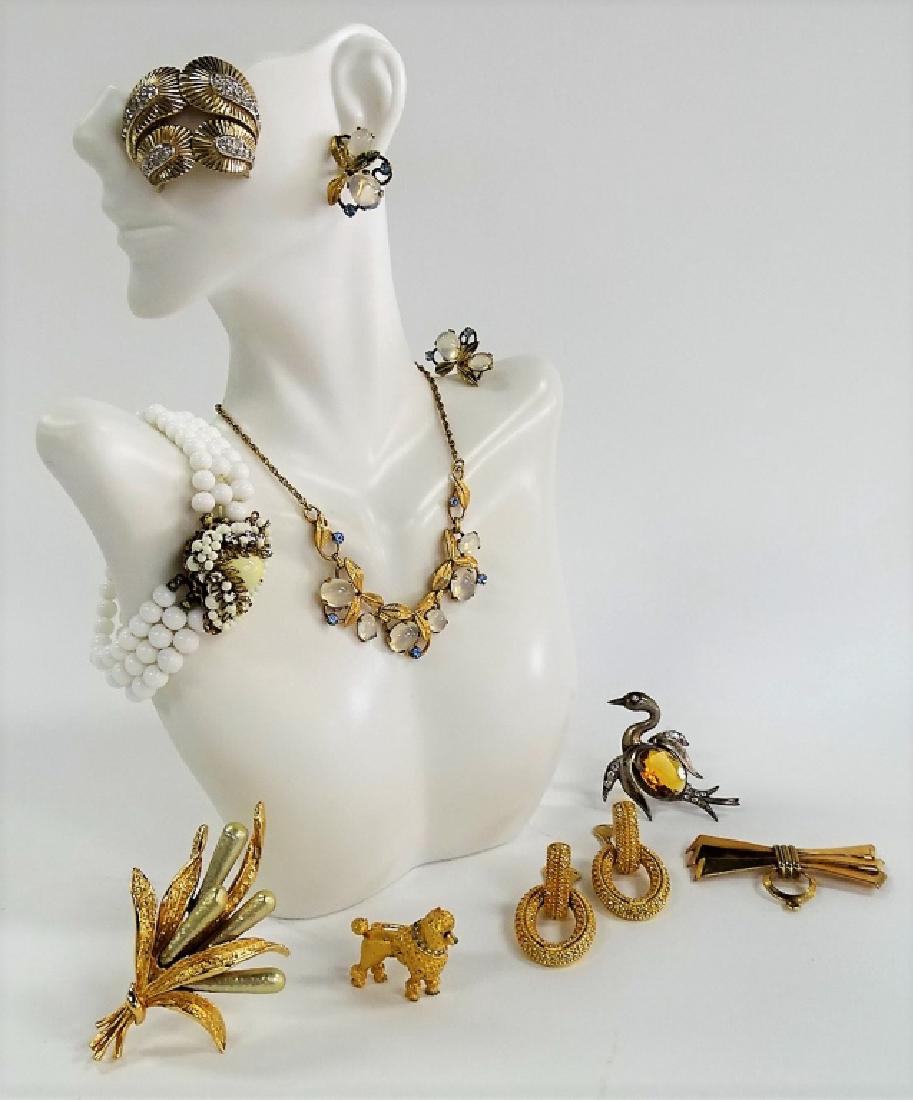 LARGE LOT OF COSTUME JEWELRY: To include a gold tone and white bead w/ marcasite bracelet, a pair of gold tone w/ marcasite earrings, a A&Z gold tone w/ blue stone and moonstone floral suite, a gold tone pin, a pair of Christian D