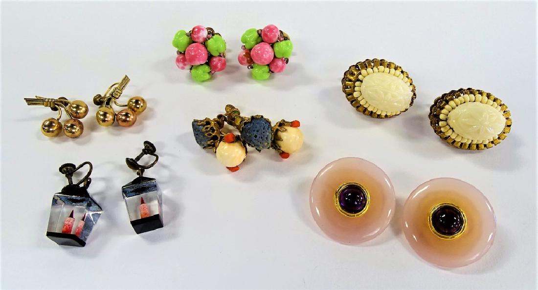 LARGE LOT OF COSTUME EARRINGS: To include a pair of Miriam Haskell gold tone w/ white bead floral earrings, a pair of Miriam Haskell gold tone w/ blue and white stone earrings, a pair of 12K GF floral earrings, a pair of black and